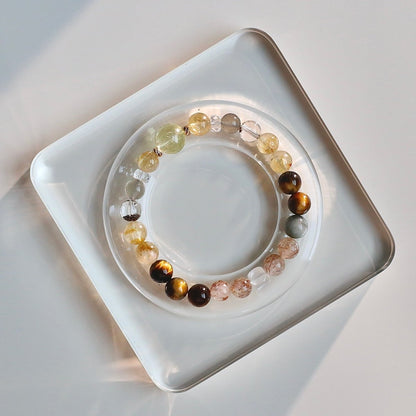 Natural yellow tiger’s eye and lemon quartz bracelet with mixed crystals for confidence and abundance.