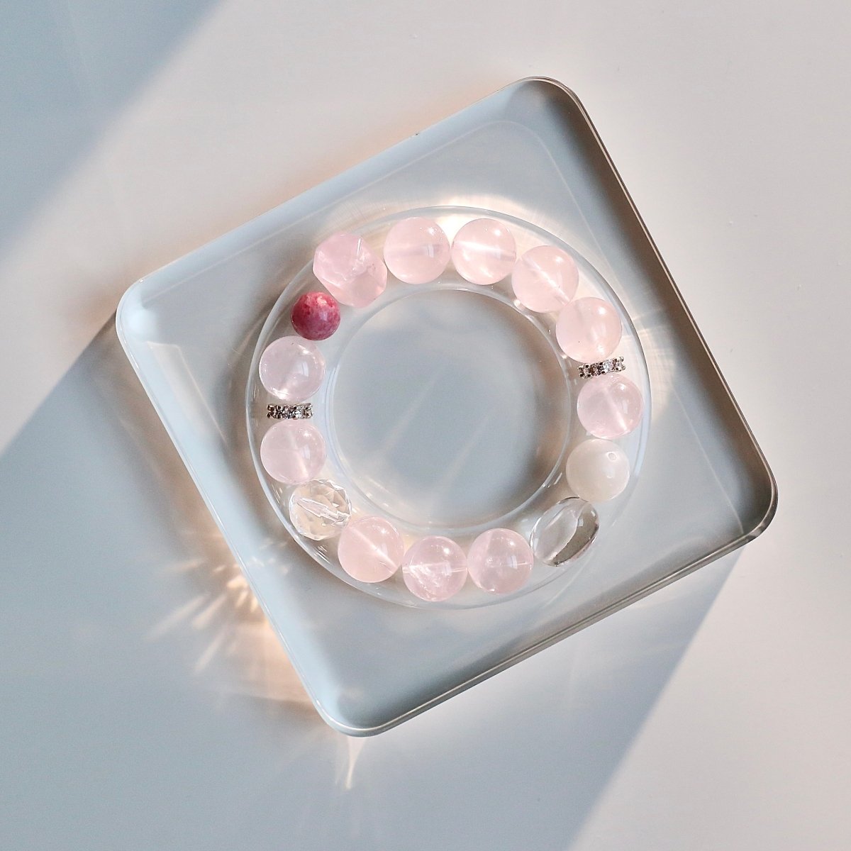 Rose quartz and rhodonite bracelet for love, self-care, and heart healing.