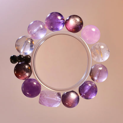 Purple gemstone bracelet with Uruguay amethyst, lepidolite, clear quartz and silver obsidian for calm emotional energy.