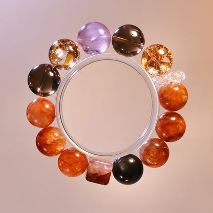 Dark orange and purple crystal bracelet with silver obsidian, smoky quartz, lavender quartz and flower agate for grounding energy.