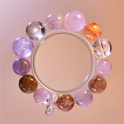 Purple and clear natural crystal bracelet with lavender quartz, super seven quartz and rabbit hair quartz for emotional healing and intuition.