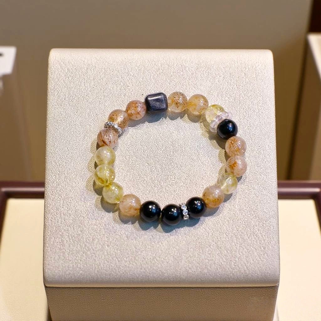 Black Super Seven, Black Obsidian, Yellow Aragonite, and Golden Aventurine bracelet for confidence and warmth
