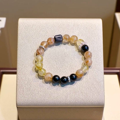 Black Super Seven, Black Obsidian, Yellow Aragonite, and Golden Aventurine bracelet for confidence and warmth