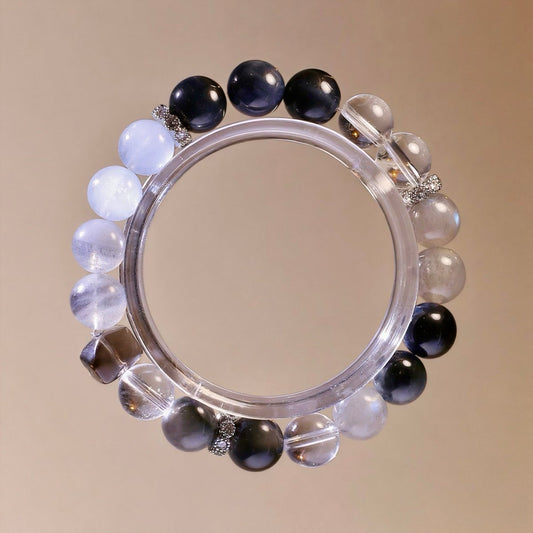Natural crystal bracelet with White Agate, Hawk’s Eye, Blue Tiger’s Eye, Gray Moonstone, Aquamarine, Smoky Quartz.