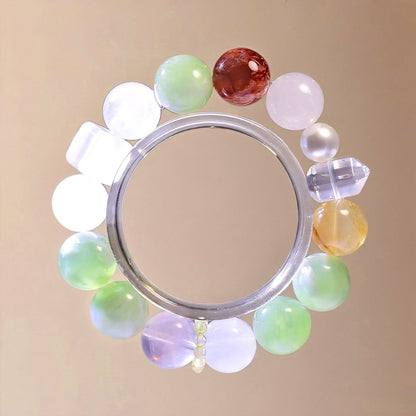 Natural crystal bracelet with Xiuyan Jade, White Phantom Quartz, Rose Quartz, Yellow Flower Agate, and Red Flower Agate.