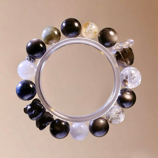 Natural crystal bracelet with Blue Tiger’s Eye, Silver Obsidian, and Blue Crystal beads.